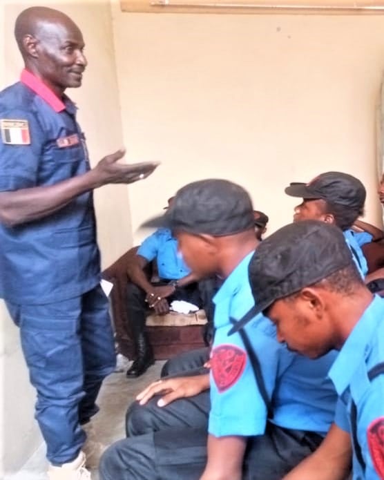 Rayam Security instructor briefing uniformed officers during a training session